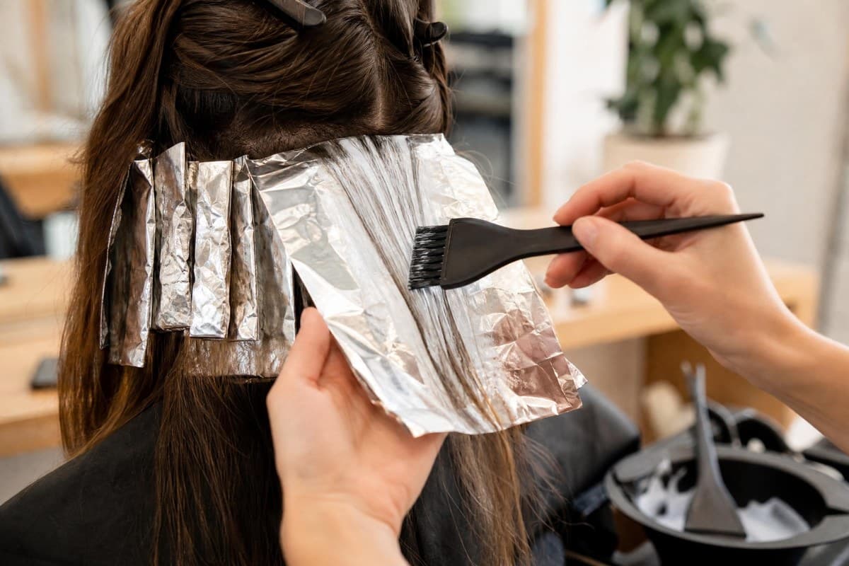 Foil highlights being applied by a Topcuts stylist.